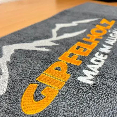 Badetuch besticken lassen Logo